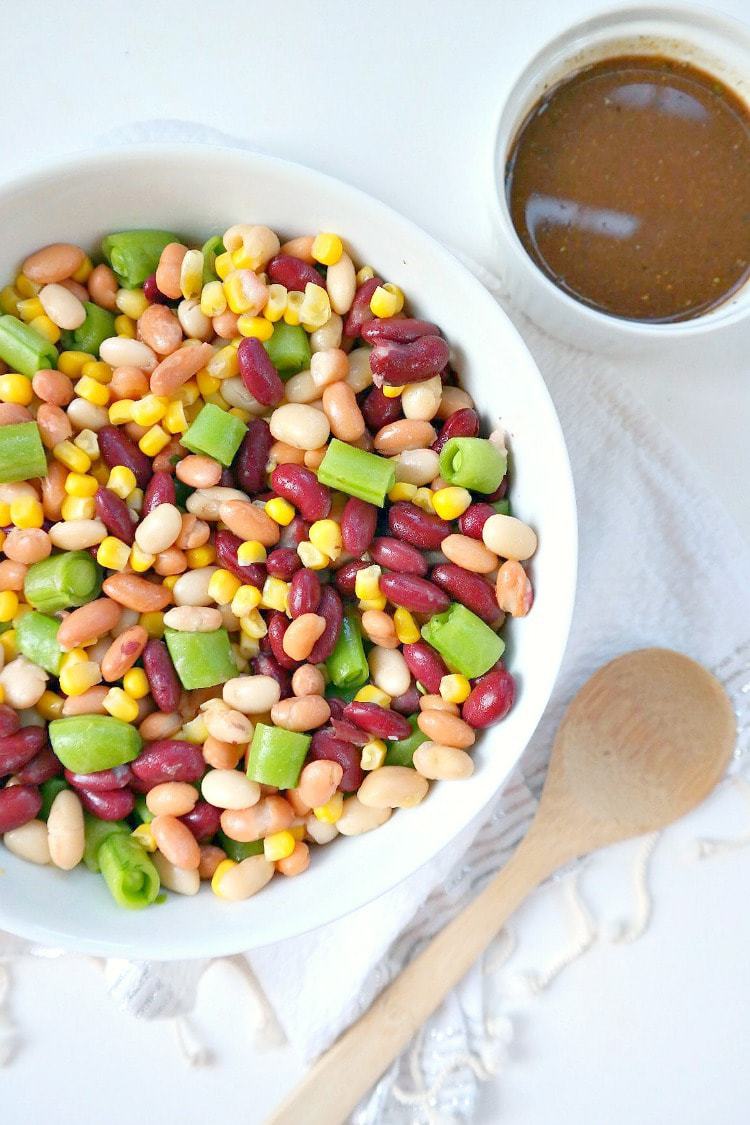 Three Bean Summer Salad. Plant Based and Vegan with an Oil Free Vinaigrette Dressing. The perfect chilled summer salad that gets better after a few hours in the fridge. Crunchy, totally satisfying, filling and healthy!