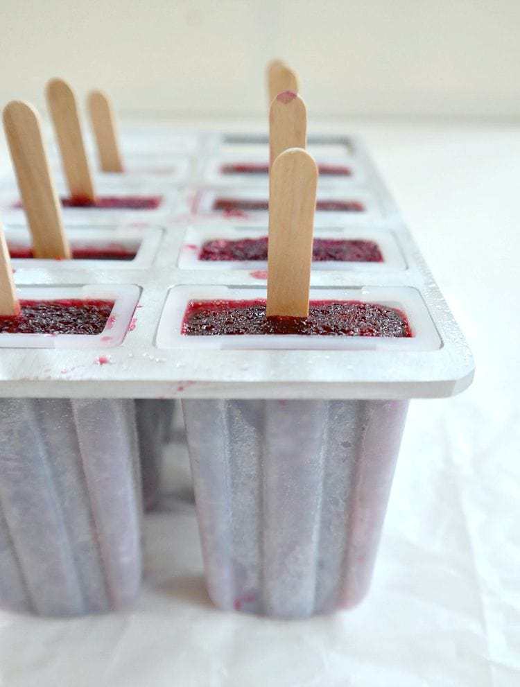 Boozy Berry Wine Pops - vegan - refreshing, light and slightly sweet with notes of smooth merlot, a hint of balsamic and a touch of fresh lime. Absolutely delicious. From The Glowing Fridge.