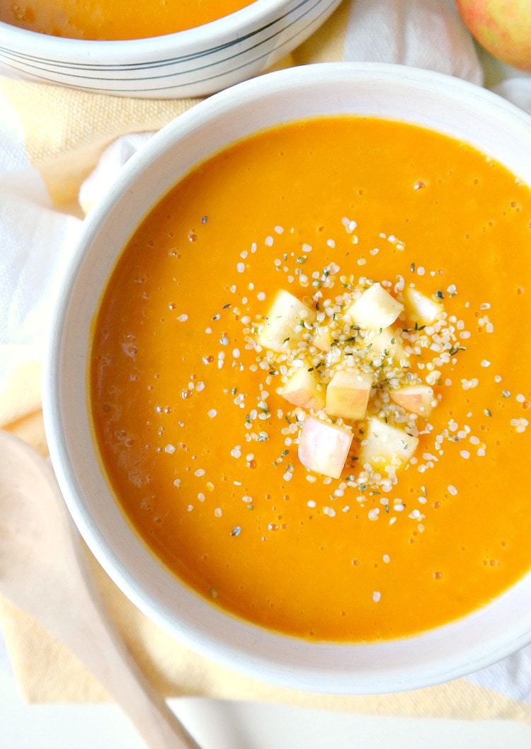 Cleansing Carrot Autumn Squash Soup - vegan, gluten-free, oil-free, low-fat and immune-boosting soup!! With carrots, honeycrisp apple, butternut squash, spicy ginger, fresh lemon, vibrant turmeric and warming cinnamon, this super cleansing, feel good soup is perfect for the cold months! From The Glowing Fridge.