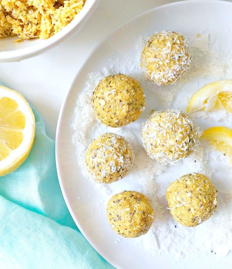 Lemon Coconut Energy Balls. VEGAN & GLUTEN FREE. Packed with superfoods like chia, hemp, maca and turmeric but tastes like lemon cookie dough. Amazing summer snack at the beach or on the go and takes 10 minutes to make. YUM! From The Glowing Fridge. #vegan #energy #balls #bites