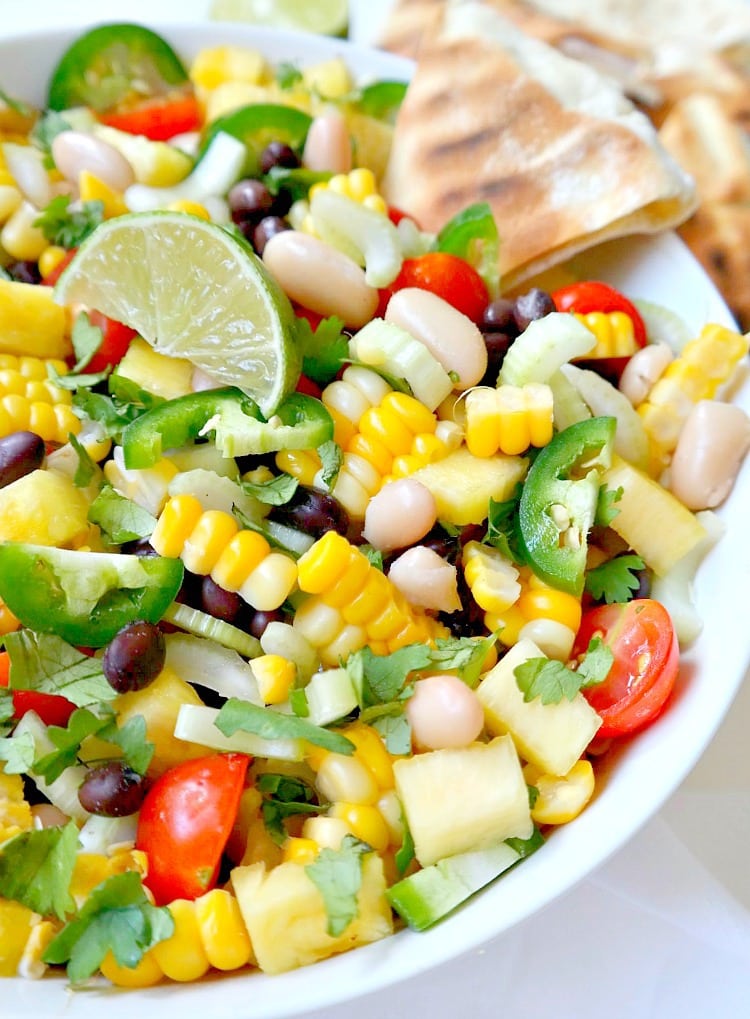 Summer Corn, Pineapple and Black Bean Salsa. Vegan & Gluten Free. Super fresh, chunky, healthy and crunchy. SO simple to make. and very versatile, can be eaten many different ways! From The Glowing Fridge #salsa #summer #addicting