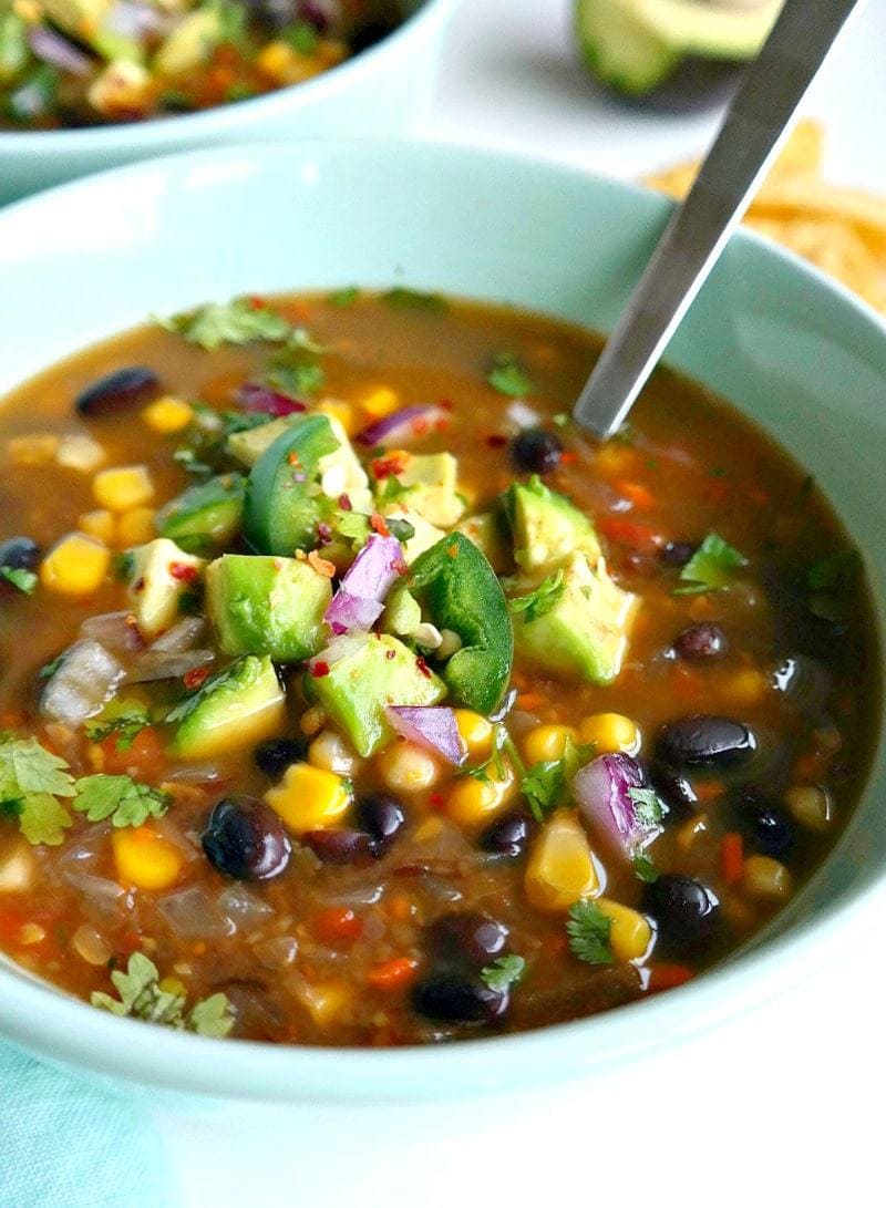 Spicy Vegan Black Bean Soup. Healthy, delicious, simple, packed with extra veggie goodness & ready in under 1 hour. This oil-free recipe is bursting with flavor and leaves plenty of leftovers. A must-try cold weather soup! #spicy #blackbean #soup #vegan