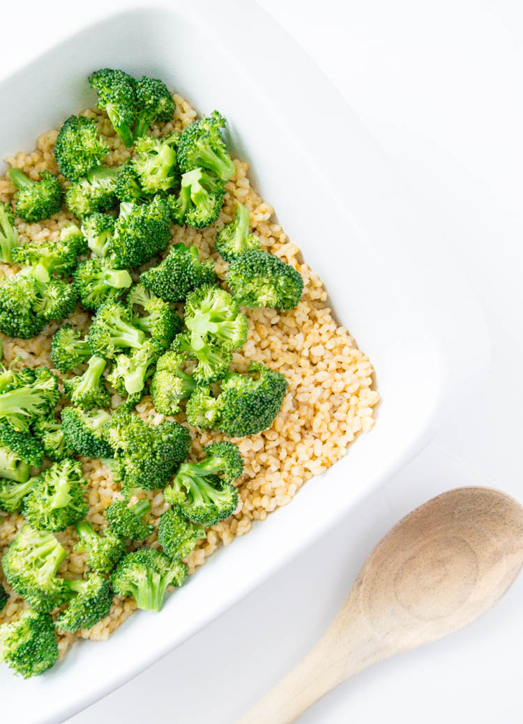 Cheesy Vegan Broccoli Brown Rice Bake. Oil Free, Gluten Free, Nut Free, Dairy Free. This is plant based cold-weather comfort food, with literally the BEST savory cheese sauce, that's also high in plant protein. #vegan #cheesy #casserole