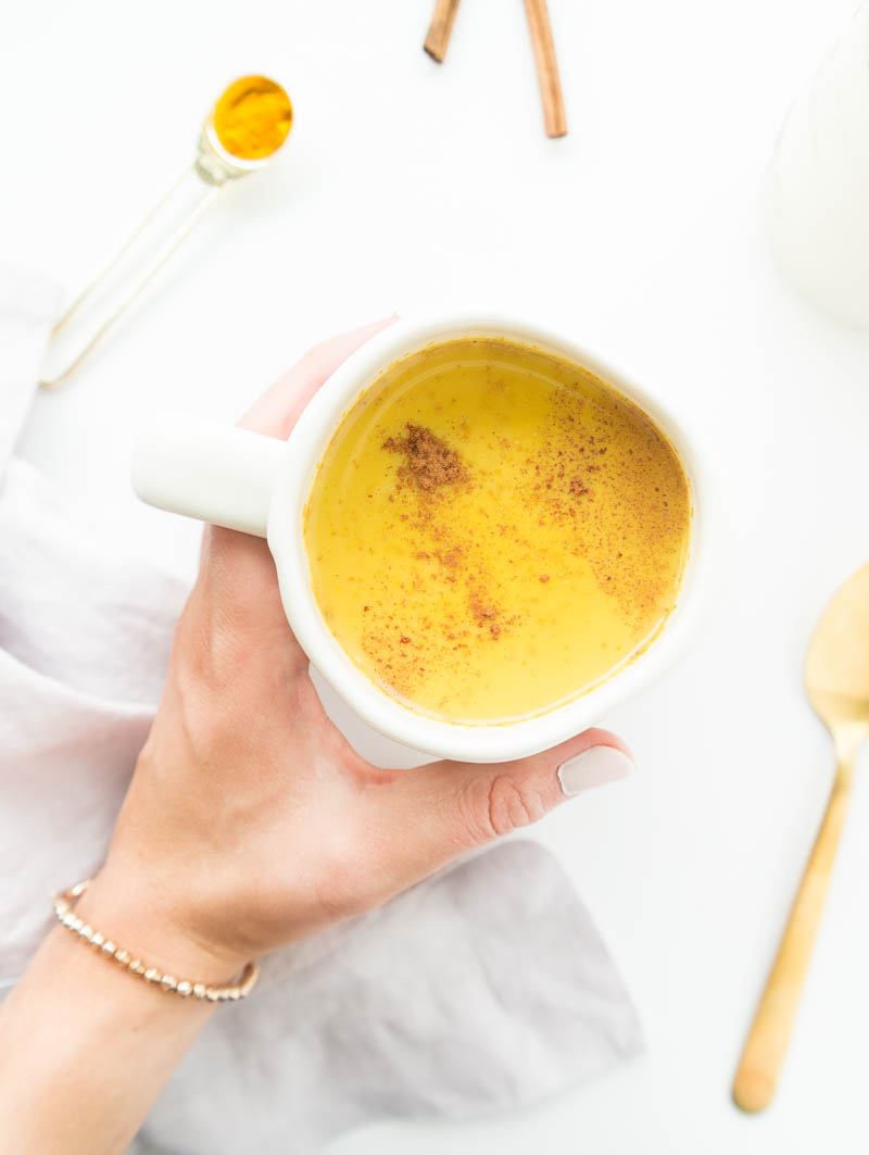 Golden Milk Turmeric Latte. Vegan and Dairy-Free. Cozy up with a warm mug of golden milk to fight off the cold, flu & inflammation. Immune-boosting recipe. #goldenmilk #vegan