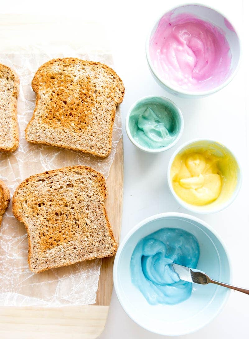 Unicorn Toast. Vegan with all natural food coloring options, from actual food! Swirled with coconut milk yogurt or dairy free cream cheese. Creative & fun breakfast or snack! #unicorn #toast #vegan