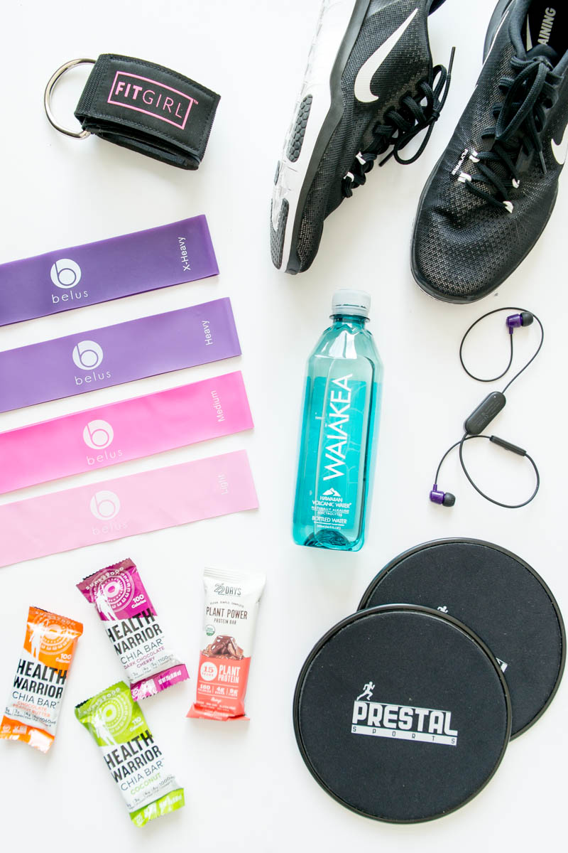 A Peek Inside My Gym Bag. My gym essentials including booty bands, sliders, training shoes, alkaline water, vegan protein snack bars, best gym duffle bag and more!