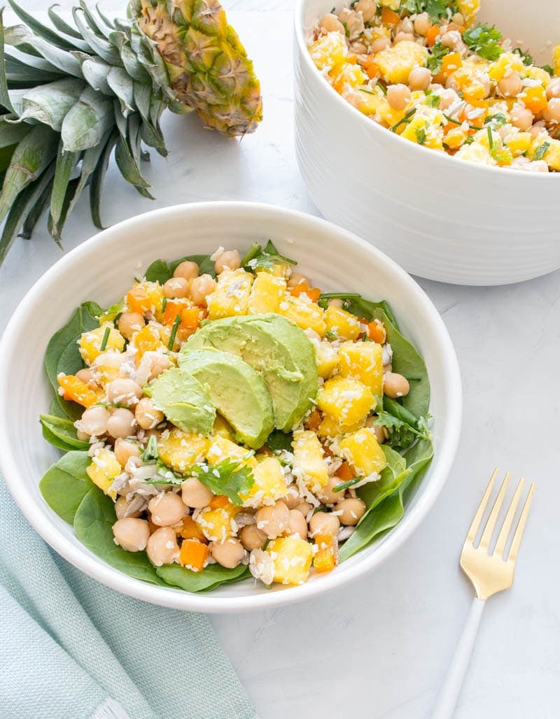Chickpea Pineapple Summer Salad. Fruity, crunchy, tangy and sweet. Bursting with summer-y and coconut flavor! Vegan, gluten free and super quick to make. Served over greens. #vegan #summer #chickpea #pineapple #salad