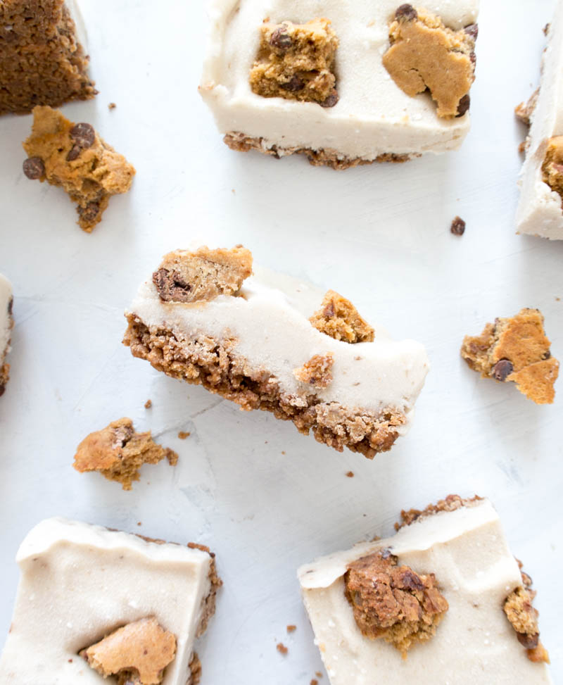 Nice Cream Cookie Bars. Vegan, Gluten Free, Dairy Free. Made with a chocolate chip protein cookie base, then layered with the creamiest banana nice cream. They make for a dreamy summer treat! #vegan #glutenfree #nicecream #cookiebars