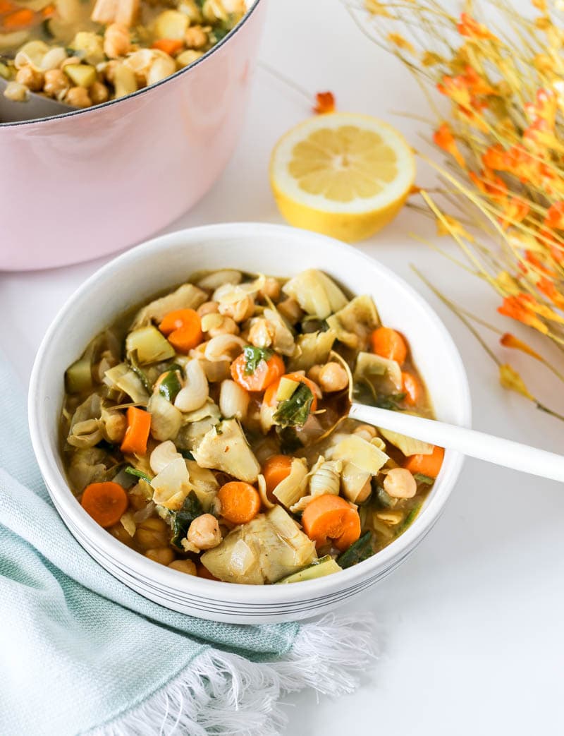 Lemony Chickpea Vegan Stew. With rosemary, lemon, veggies, chickpeas and gluten free pasta. Warming, satisfying and heart-healthy! A one-pot vegan stew that's light and simple. #onepot #vegan #stew